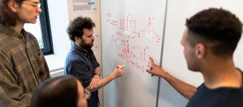 Engineers discussing a problem